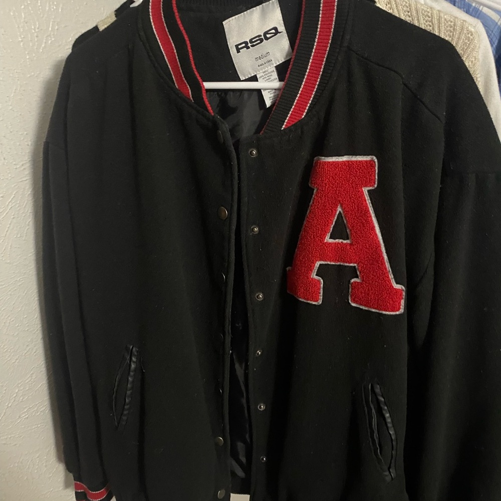 Tilly’s black and red varsity jacket